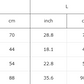 A size chart with various sizing information for Nice Emoji sweaters.